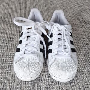 Adidas Superstar White Sneakers with Black and Gold Accents